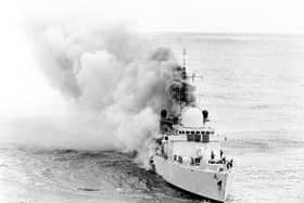 A Ministry of Defenc picture of the stricken Destroyer HMS Sheffield, smoke pouring out of her after she had been hit by an exocet missile, during the Falklands conflict. She later sank with the loss of 20 lives.