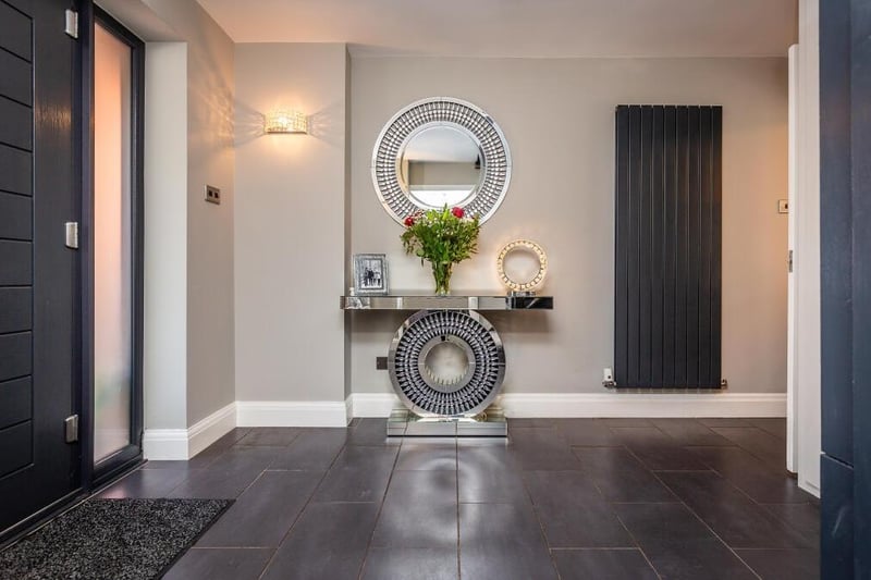 This exquisite entrance hallway sets the tone for the rest of the property. Light and airy, it is the very essence of modernity.