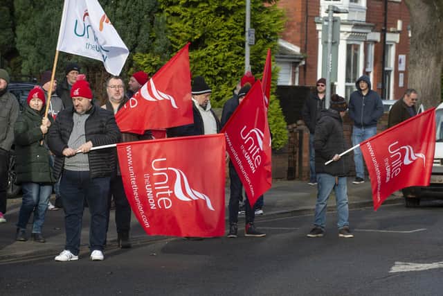 Unite members protest outside Mr Clarke-Smith's co-hosted jobs fair.