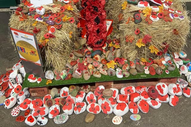 The Remembrance pebbles display in Morrisons. The hay has been donated to Murphy the resident donkey at Rhubarb Farm, Langwith.
