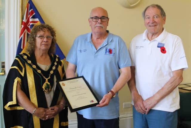 Grant Cullen, Worksop RBL branch secretary and poppy appeal organiser pictured with Madelaine Richardson and David Scott.