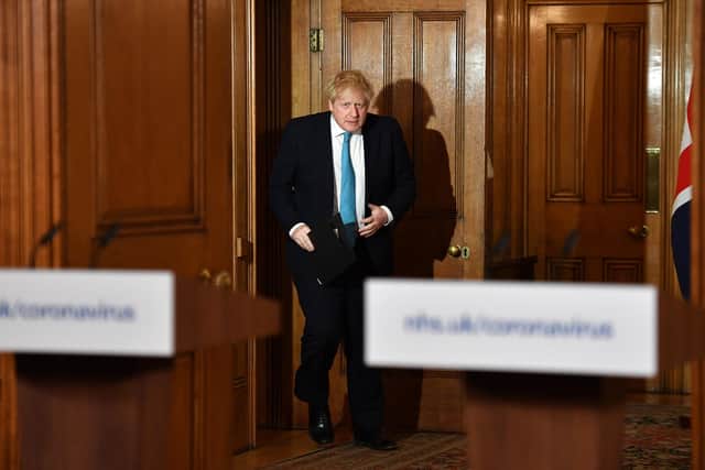 Prime Minister Boris Johnson arrives to attend a coronavirus news conference inside 10 Downing Street, London. PA Photo. Picture date: Thursday March 19, 2020. Coronavirus (Covid-19) has spread to over 177 countries in a matter of weeks, claiming over 8,000 lives and infecting over 230,000. Leon Neal/PA Wire