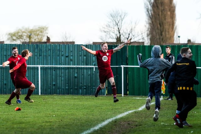 Steven Wankiewicz celebrates after scoring a 97th-minute winner after being 2-0 down at Bottesford Town to put Worksop top of the table.
