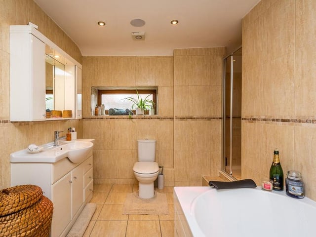 The attractive family bathroom is fitted with all you need, including bath, shower enclosure, wash hand basin and WC.