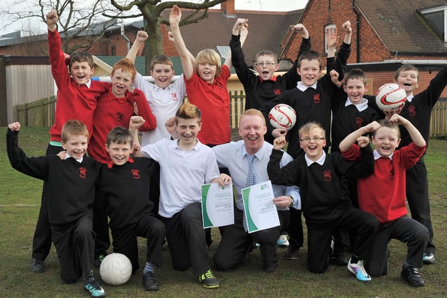Pupil Nathan Langley nominated teacher John Alexander for the Best Teacher Award and Redlands Boys Football team for the Best Sports Team award.  Nathan is pictured centre with Mr Alexander and the Redlands Boys Football team in 2014.