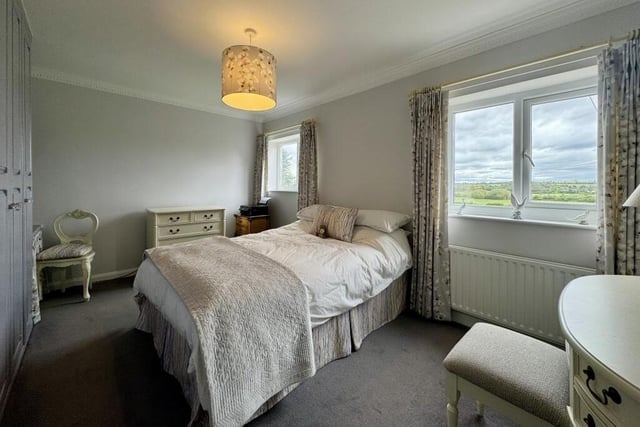 Bedroom number three boasts two windows overlooking the front of The Drive house, and also fitted wardrobes.