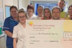 The cheque being presented to hospital staff