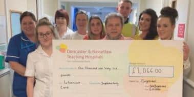The cheque being presented to hospital staff