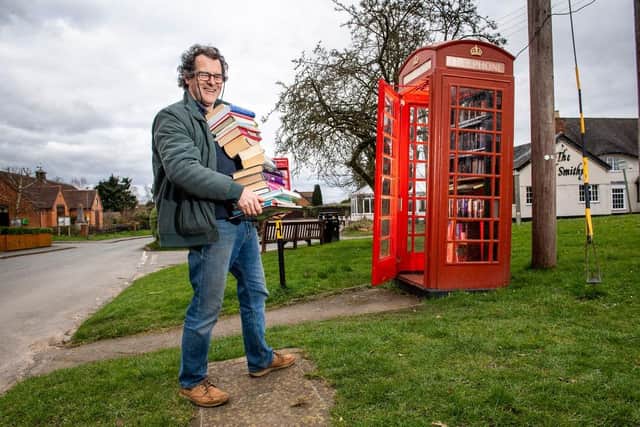 Undated handout photo issued by BT of a telephone box, which has been transformed into a free book exchange in Warwickshire as part of the telecom company's Adopt a Kiosk scheme. Thousands of the traditional red coloured phone boxes are being offered to communities to be used for anything from housing books to defibrillators.  Photo credit: BT/PA Wire