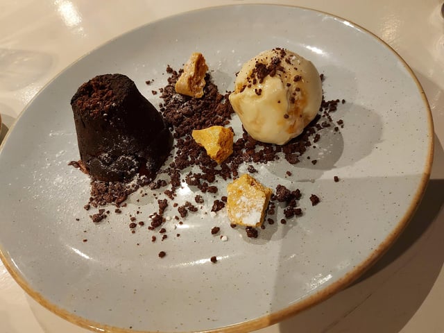 Dish Detective was particularly fond of the jellyfish themed lampshades, and the chocolate fondant was the highlight of the evening. The reviewer said: 'It is extremely satisfying to put the spoon into the fondant and watch the rich chocolate sauce spill out. And it comes with chunks of honeycomb, honeycomb ice cream and chocolate soil, which all goes together so well.' It was one of the rare occasions where Dish Detective enjoyed the dessert even more than the main dish.