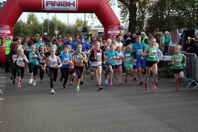 Youngsters go off at the start of the fun run.