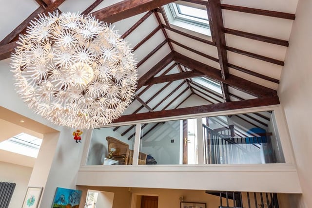 Here's a close-up of the amazing ceiling in the family room and also the mezzanine area, which gives access to the property's roof terrace.