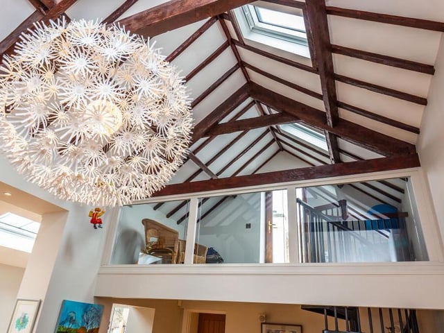 Here's a close-up of the amazing ceiling in the family room and also the mezzanine area, which gives access to the property's roof terrace.