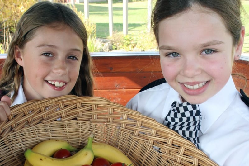 Libby Allen (left) and Maisie Seaman at Woodthorpe School's harvest festival in 2007.