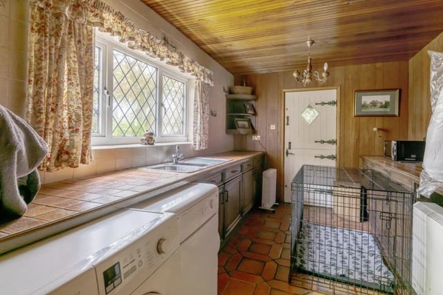 Just off the kitchen is this handy utility room, which includes space for a washing machine.
