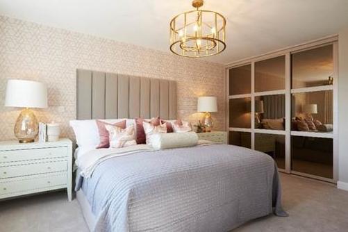 The aim of the master bedroom is to exude luxury and glamour. Jayne Swift, of Jones Homes, says this has been achieved by the neutral gold and pink colour palette. She says: "You can see how subtly the colours are used in the light fitting, wallpaper, chest of drawer handles, light shades and wardrobe doors. The bespoke headboard is also tall enough to make a real impact. The room has a grand identity."