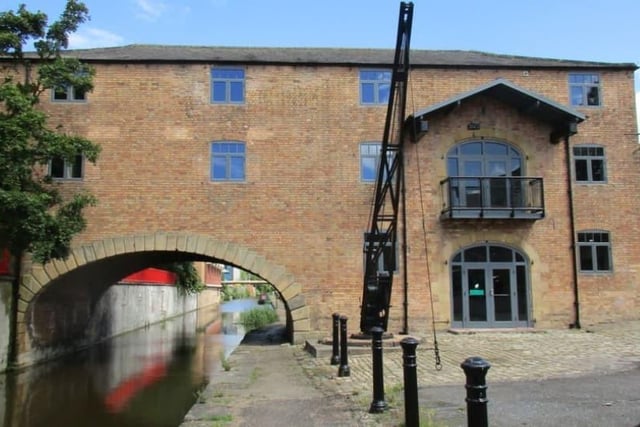 Built in 1840, the building is in yellowish brick with stone dressings and a hipped slate roof. There are three storeys and four bays. To the south is an elliptical arch with voussoirs and a rusticated soffit spanning the Chesterfield Canal.