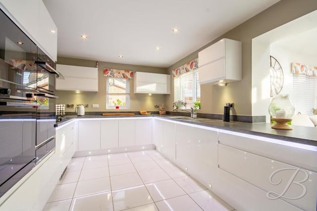 The modern kitchen comes with a fantastic range of units and cabinets with complementary worktops over. There is an integrated double oven and additional single oven, while other integrated appliances include a microwave and dishwasher.