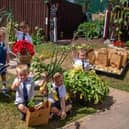 Happy youngsters at St John's Church Of England Academy in Worksop enjoy working in its Tiny Tots allotment.