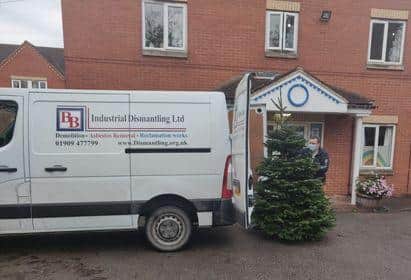 Ian Davenport, of B&B Industrial Dismantling, delivers a tree for the home