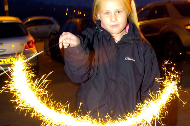 Lucy Perrins, aged 10, with a sparkler at a bonfire night event at the Hollin Bush pub, Sheffield in 2012