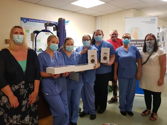 Jacqueline Jackson's family pictured with Ward C1 staff.