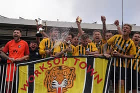 Worksop Town, pictured lifting the NCEL Premier Division trophy in April last year, have another reason to celebrate after reaching its fundraising target to keep the club alive. Photo: Lewis Pickersgill.