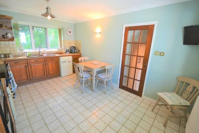 The kitchen possesses plenty of space for a breakfast table or dining table.