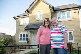•	Judith and Steve Short outside the front of their new home at Jones Homes’ Cavendish Park developm