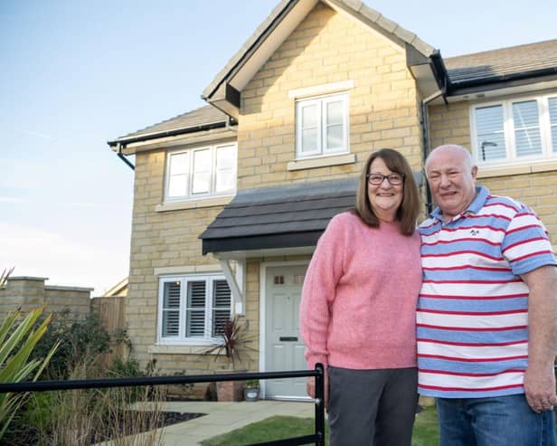 •	Judith and Steve Short outside the front of their new home at Jones Homes’ Cavendish Park developm