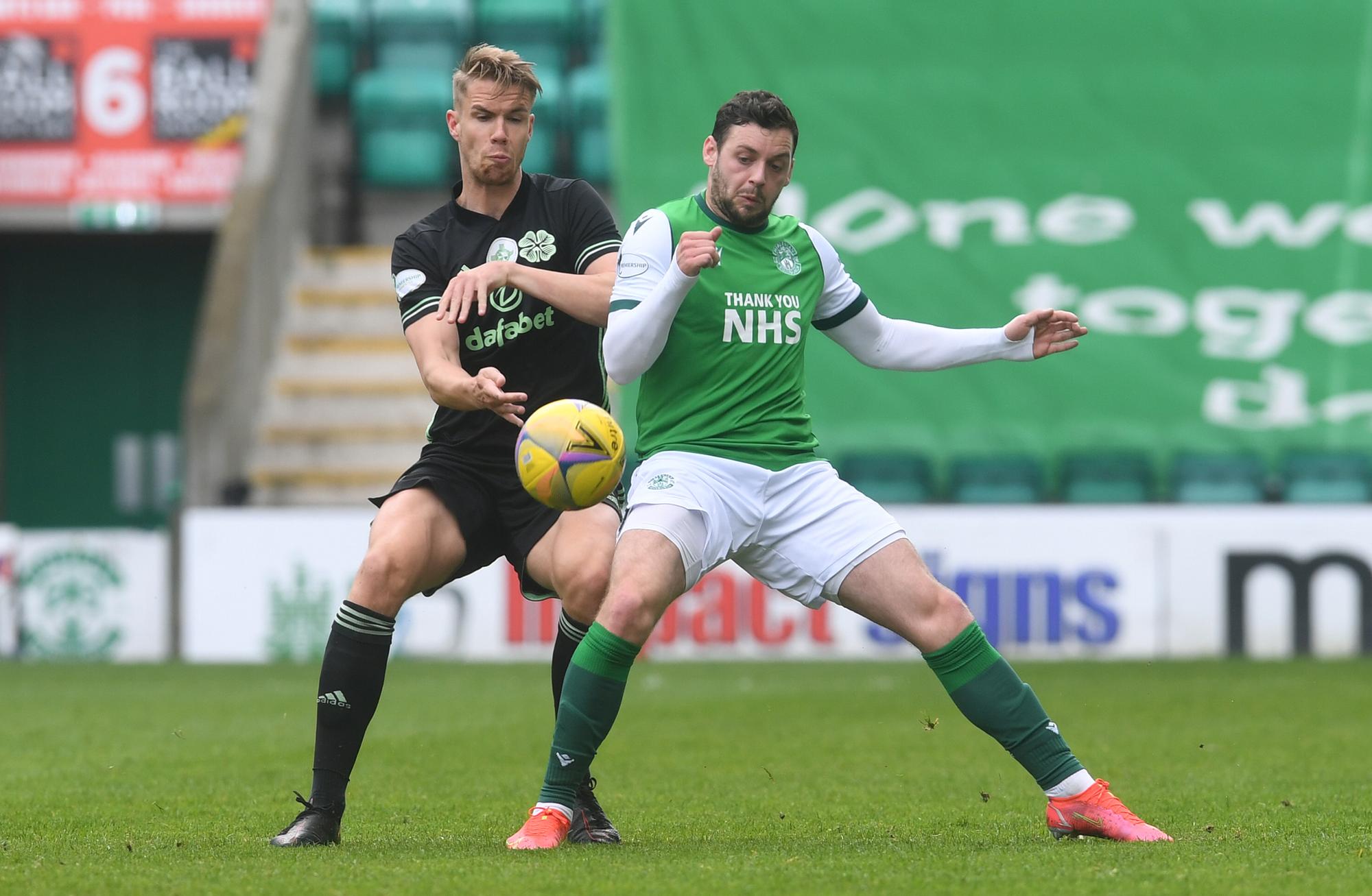 Kris Ajer of Celtic and Hibs' Drey Wright battle for the ball at Easter Road