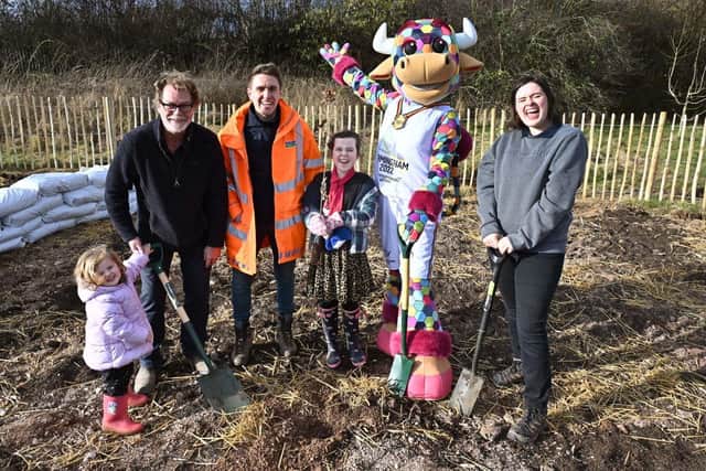 Commonwealth Games mascot Perry the Bull joins youngsters and volunteers at a Tiny Forest planting