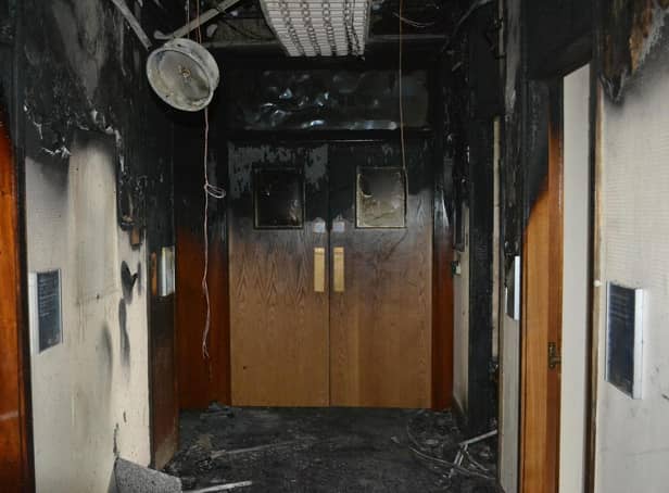 The wrecked aftermath of the Conservative group's corridor where the fire started
