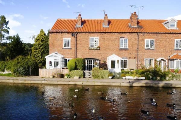Ducks make their way along Chesterfield Canal in front of this two-bedroom cottage in the hamlet of Turnerwood at Thorpe Salvin, near Worksop. Offers in the region of £200,000 are being sought by estate agents Yopa.