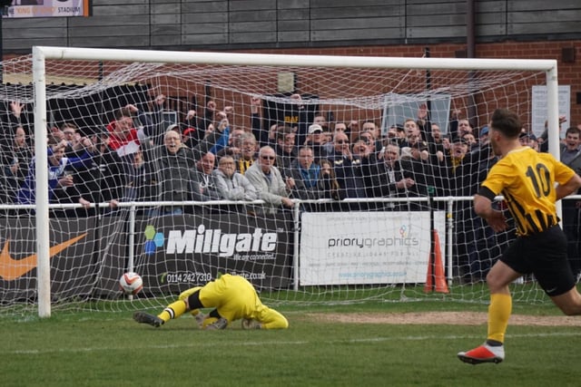 Craig Mitchell puts Worksop ahead against second-placed Penistone Church in front of a record-breaking crowd of 1628.