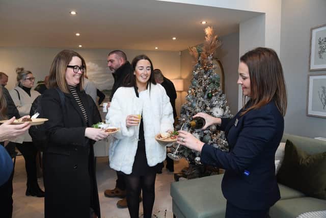 •	Lambcote Meadows Sales Advisor Lindsey Morgan with guests at the business event 