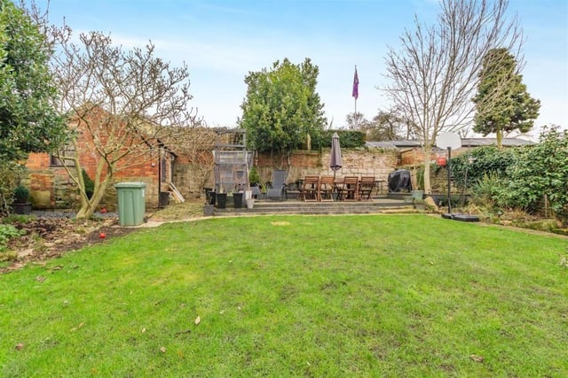 At the bottom of the lawn in the rear garden sits an extensive decked patio.