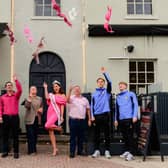 Doncaster Rovers players Tom Nixon, Bayley McCann, Darren Robinson and Jordan Thomas support the All in Pink campaign championed by Ms Nottinghamshire GB 2026 Charlotte Lister.