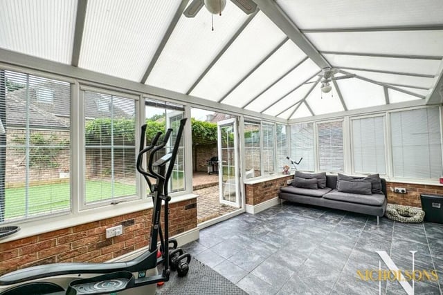 The conservatory offers a touch of class. It is of dwarf-wall construction, with a hipped polycarbonate roof, and has French doors leading out to the back garden. Other assets include a ceramic tiled floor and ceiling-mounted lighting with fan.