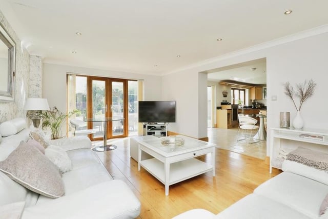 Off the kitchen at the £660,000 property is this large, front-facing lounge or living room,