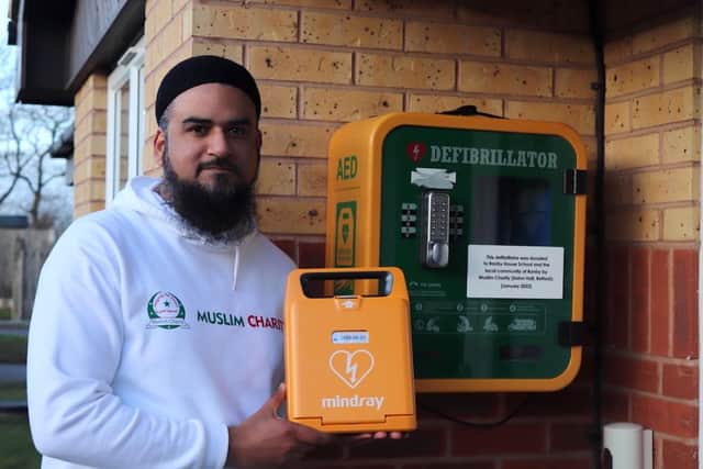 UK director of Muslim Charity, Maroof Pirzada, with one of the defibrillators.