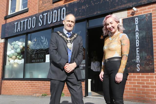 Picutred mayor Tony Eaton with Faye Skinner, new businesses owner of Ta2 Ink on Newcastle Avenue.