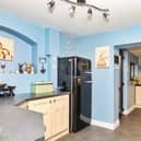 In the kitchen there is a host of wall and base units along with brick built cooker area with space for range style cooker. Door leading to rear garden, rear facing double glazed window and tiled floor.