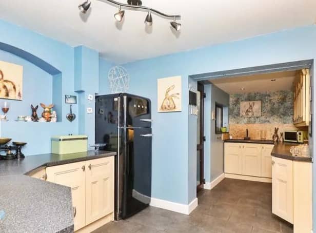In the kitchen there is a host of wall and base units along with brick built cooker area with space for range style cooker. Door leading to rear garden, rear facing double glazed window and tiled floor.