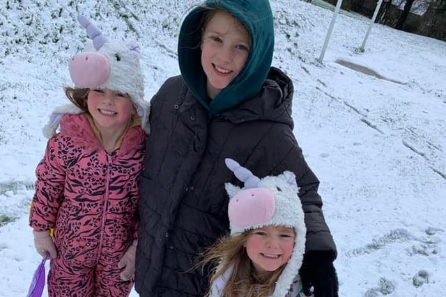 These three are wrapped up warm to enjoy the snow