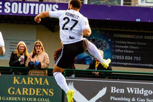 New Worksop Town loanee Mason Bennett celebrates a debut goal at Buxton, Pic: Zac Constantine