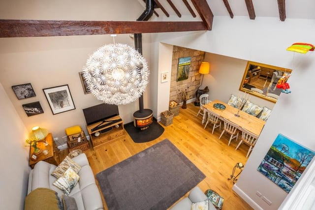 At the heart of the Carlton in Lindrick home is this family room, viewed from a mezzanine area above. Its double-height, beamed, vaulted ceiling injects plenty of character.