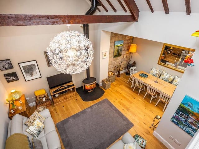 At the heart of the Carlton in Lindrick home is this family room, viewed from a mezzanine area above. Its double-height, beamed, vaulted ceiling injects plenty of character.