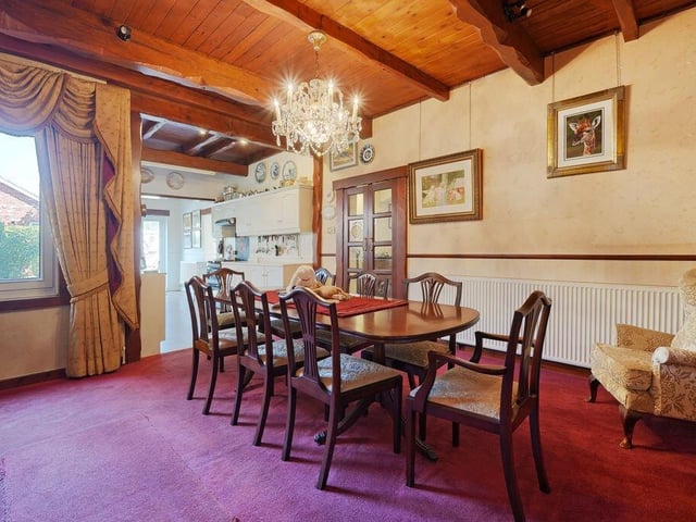 The beamed dining room.