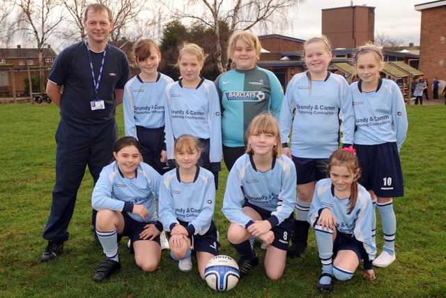 St Augustine's Junior School girls football team.  Pictured with Chris Kelly.